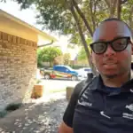 Urban Brothers technician outside home with service truck in background